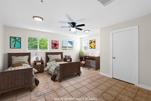 12922 Staton Dr, Austin, TX 78727 - bedroom with light tile patterned flooring and ceiling fan
