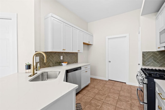12922 Staton Dr, Austin, TX 78727 - kitchen featuring appliances with stainless steel finishes, decorative backsplash, light countertops, and white cabinets