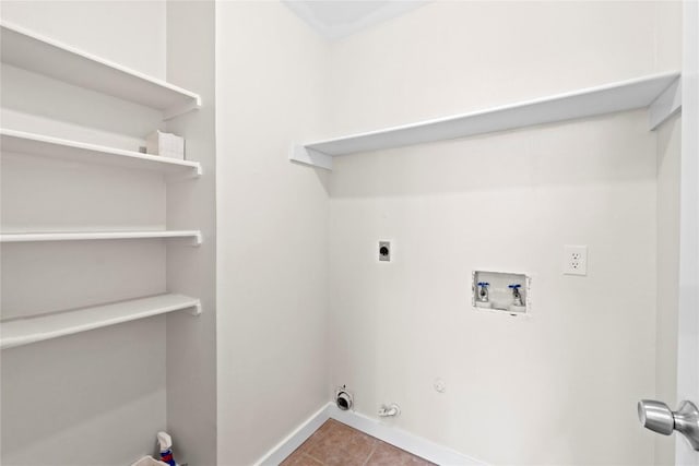 12922 Staton Dr, Austin, TX 78727 - washroom featuring washer hookup, hookup for an electric dryer, hookup for a gas dryer, and tile patterned floors