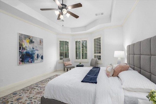 13212 Coleto Creek Trl, Austin, TX 78732 - carpeted bedroom with a raised ceiling and a ceiling fan