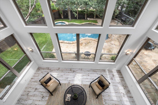 13212 Coleto Creek Trl, Austin, TX 78732 - unfurnished living room featuring a towering ceiling and plenty of natural light