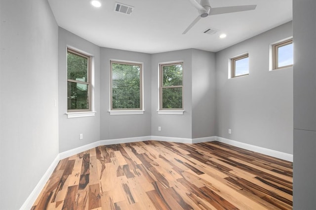 13212 Coleto Creek Trl, Austin, TX 78732 - spare room featuring wood finished floors, ceiling fan, and recessed lighting