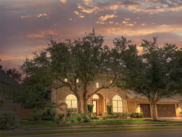 13212 Coleto Creek Trl, Austin, TX 78732 - view of front facade with a yard and stone siding
