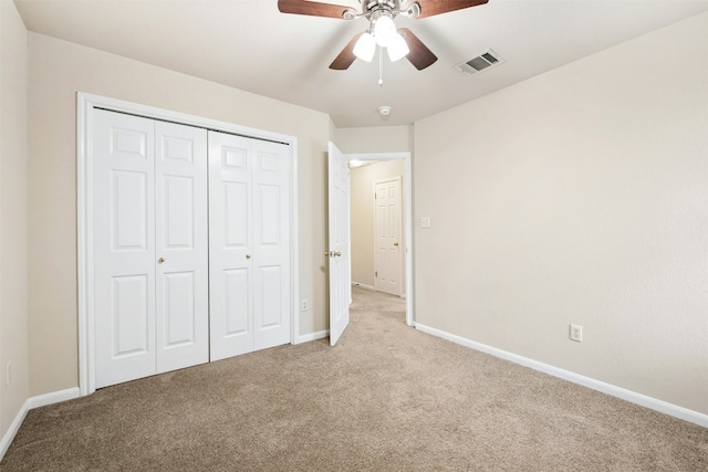 6710 Telluride Trl, Austin, TX 78749 - unfurnished bedroom featuring light carpet, a closet, and a ceiling fan