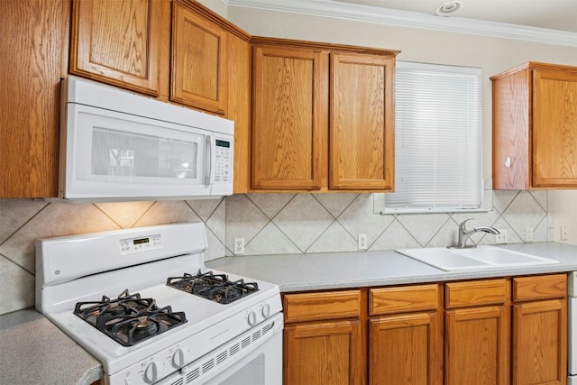 6710 Telluride Trl, Austin, TX 78749 - kitchen featuring white appliances, crown molding, light countertops, backsplash, and brown cabinetry