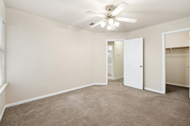 6710 Telluride Trl, Austin, TX 78749 - unfurnished bedroom with carpet floors, a spacious closet, ceiling fan, and a closet