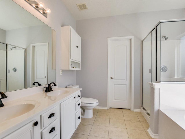 241 Sunnyside Dr, Kyle, TX 78640 - bathroom featuring a shower stall, double vanity, a garden tub, and tile patterned floors