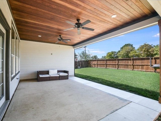 241 Sunnyside Dr, Kyle, TX 78640 - fenced backyard with a patio area and ceiling fan