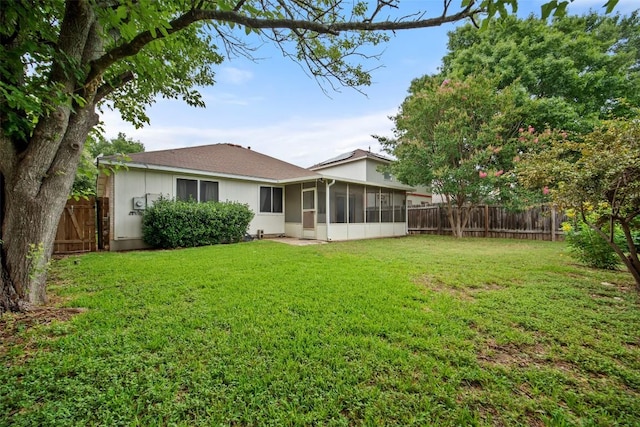1009 Laurelleaf Dr, Pflugerville, TX 78660 - rear view of house with a sunroom and a fenced backyard
