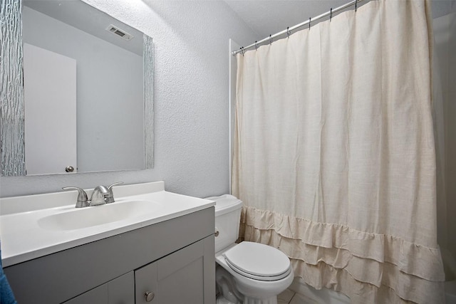 1009 Laurelleaf Dr, Pflugerville, TX 78660 - full bathroom with a textured wall and vanity