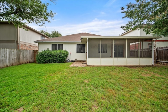 1009 Laurelleaf Dr, Pflugerville, TX 78660 - back of property with a fenced backyard and a sunroom