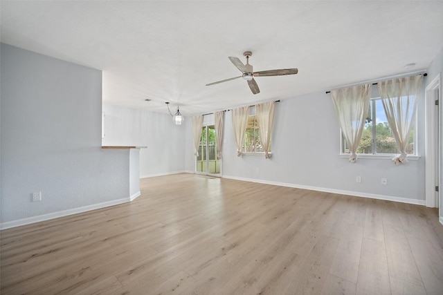 1009 Laurelleaf Dr, Pflugerville, TX 78660 - unfurnished living room with a ceiling fan and light wood-type flooring