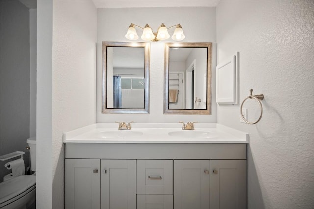 1009 Laurelleaf Dr, Pflugerville, TX 78660 - full bathroom featuring double vanity and a textured wall