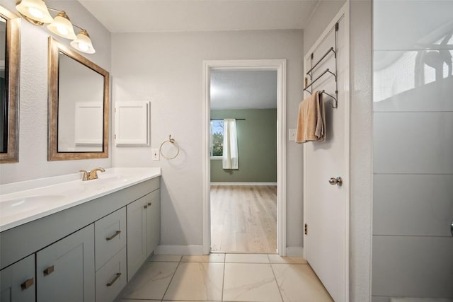 1009 Laurelleaf Dr, Pflugerville, TX 78660 - bathroom with double vanity and marble finish floors