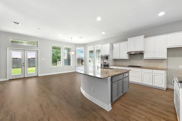 20024 Abigail Way, Pflugerville, TX 78660 - kitchen featuring under cabinet range hood, white cabinetry, recessed lighting, appliances with stainless steel finishes, and gray cabinets