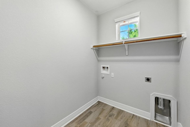 20024 Abigail Way, Pflugerville, TX 78660 - washroom featuring hookup for an electric dryer, hookup for a washing machine, wood finished floors, and hookup for a gas dryer