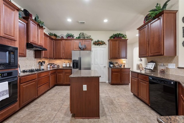 3509 Twin Branch Dr, Cedar Park, TX 78613 - kitchen with black appliances, decorative backsplash, a kitchen island, dark stone counters, and recessed lighting