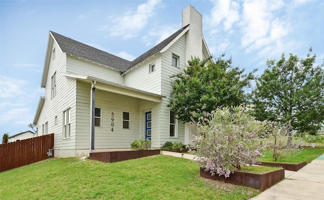 5904 Florencia Ln, Austin, TX 78724 - view of front of house featuring a chimney and roof with shingles