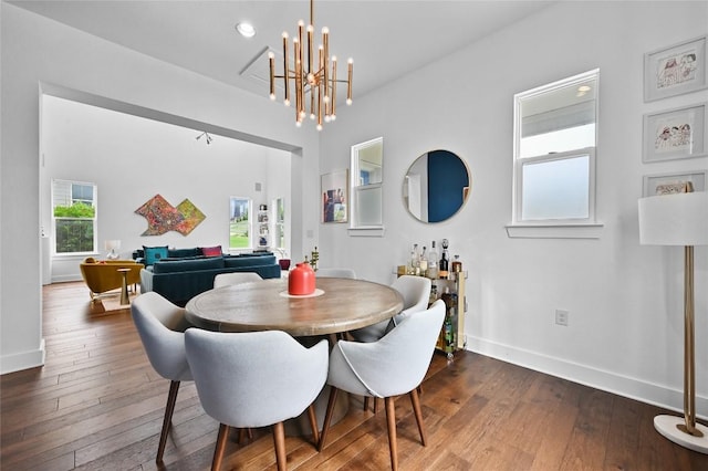 5904 Florencia Ln, Austin, TX 78724 - dining room with dark wood finished floors and a chandelier