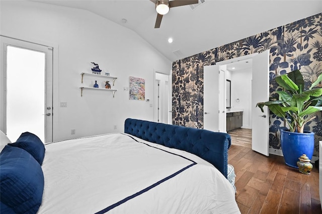 5904 Florencia Ln, Austin, TX 78724 - bedroom featuring wallpapered walls, lofted ceiling, wood finished floors, a ceiling fan, and ensuite bathroom