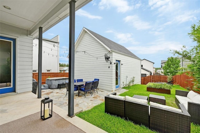 5904 Florencia Ln, Austin, TX 78724 - fenced backyard featuring a hot tub, an outdoor hangout area, and a patio area