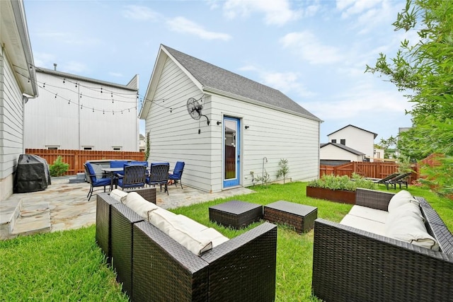 5904 Florencia Ln, Austin, TX 78724 - back of property featuring an outdoor living space, a patio, a fenced backyard, and a vegetable garden