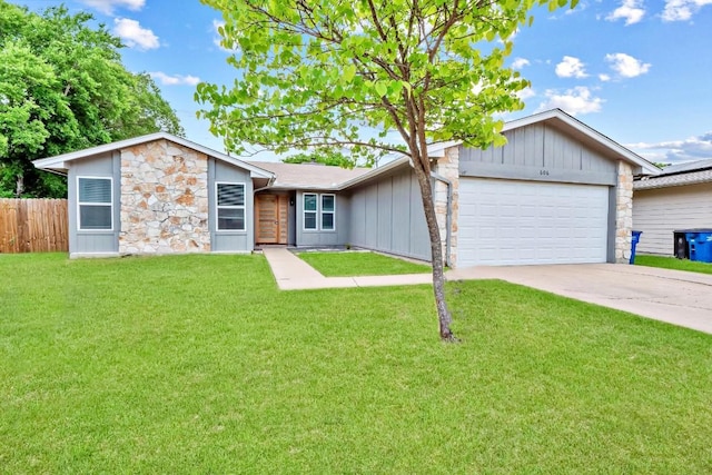 606 Elderberry Cv, Austin, TX 78745 - mid-century inspired home featuring stone siding, board and batten siding, a garage, and concrete driveway
