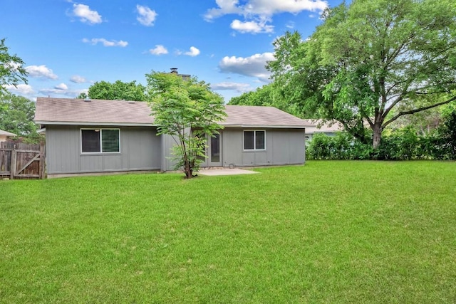 606 Elderberry Cv, Austin, TX 78745 - rear view of house featuring a chimney and roof with shingles