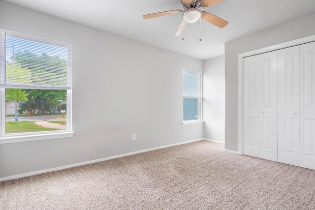 606 Elderberry Cv, Austin, TX 78745 - unfurnished bedroom featuring carpet flooring, a closet, and a ceiling fan