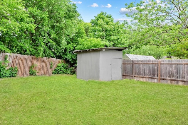 606 Elderberry Cv, Austin, TX 78745 - fenced backyard featuring a storage unit