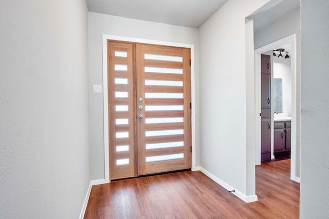 606 Elderberry Cv, Austin, TX 78745 - entryway featuring healthy amount of natural light, wood finished floors, and a textured wall