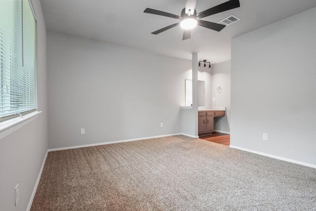 606 Elderberry Cv, Austin, TX 78745 - carpeted spare room with ceiling fan and baseboards