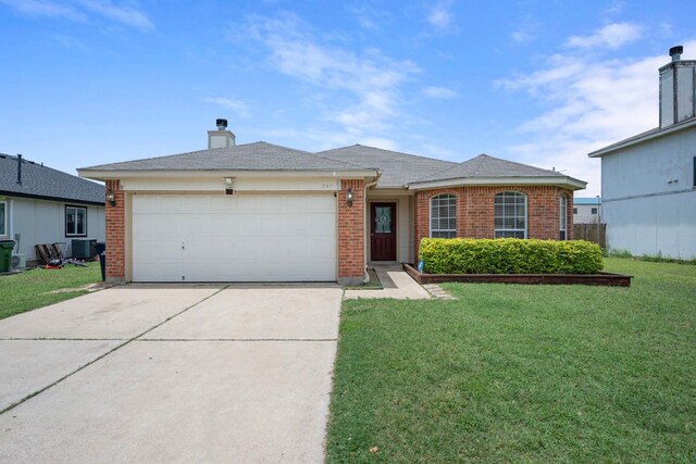 707 Eaglecreek Dr, Leander, TX 78641 - single story home with concrete driveway, a front lawn, an attached garage, and brick siding