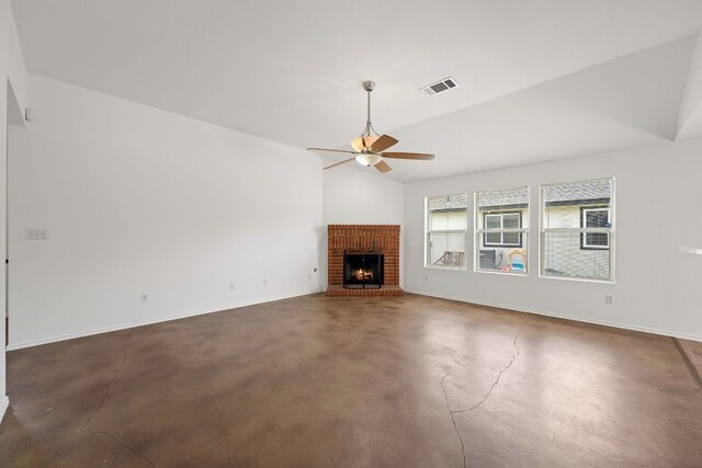 707 Eaglecreek Dr, Leander, TX 78641 - unfurnished living room featuring ceiling fan, finished concrete floors, vaulted ceiling, and a brick fireplace