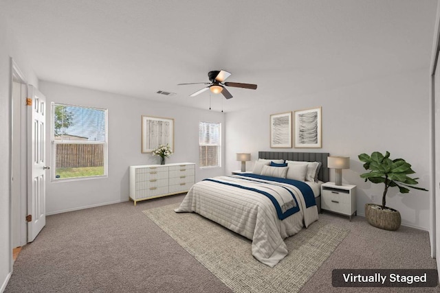 707 Eaglecreek Dr, Leander, TX 78641 - carpeted bedroom with baseboards and ceiling fan