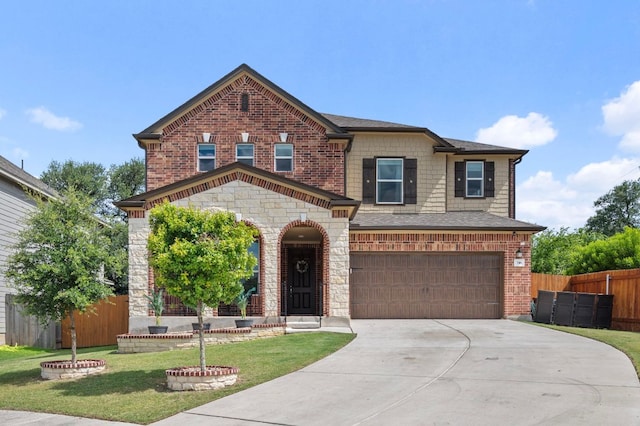716 Madalin Rue Ct, Leander, TX 78641 - view of front of house with an attached garage, concrete driveway, brick siding, and stone siding