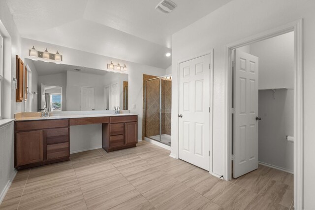 716 Madalin Rue Ct, Leander, TX 78641 - full bath with double vanity, a stall shower, and tile patterned floors