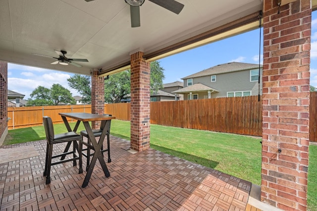 716 Madalin Rue Ct, Leander, TX 78641 - fenced backyard with ceiling fan, a patio, and outdoor dining area