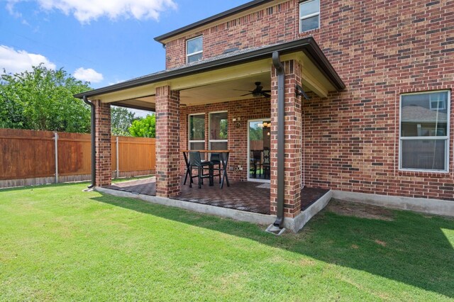 716 Madalin Rue Ct, Leander, TX 78641 - rear view of property with brick siding, ceiling fan, and a patio