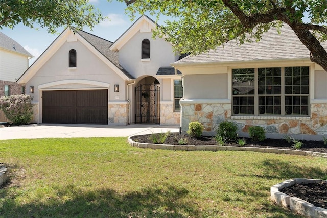 2105 Peoria Dr, Leander, TX 78641 - view of front of home with stone siding, stucco siding, and a garage