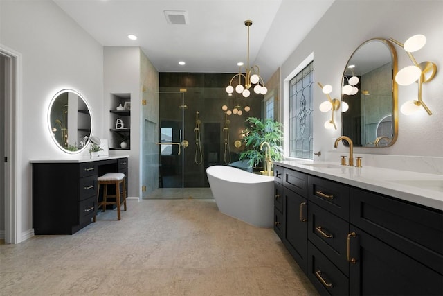 2105 Peoria Dr, Leander, TX 78641 - full bath with vanity, a stall shower, a soaking tub, built in features, and a chandelier
