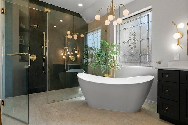2105 Peoria Dr, Leander, TX 78641 - bathroom with a shower with door, a soaking tub, vanity, and plenty of natural light