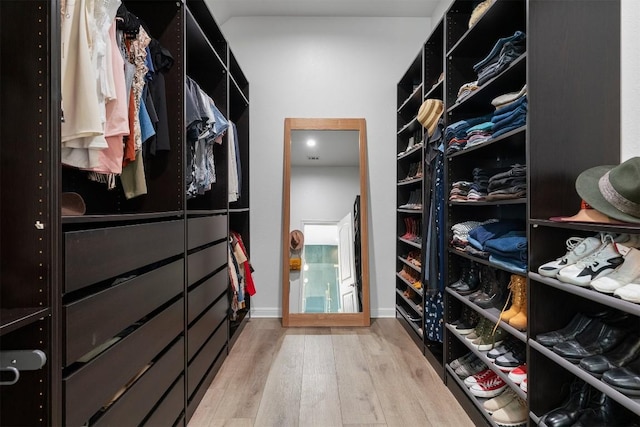 2105 Peoria Dr, Leander, TX 78641 - walk in closet featuring wood finished floors