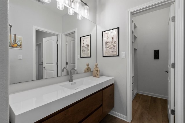2105 Peoria Dr, Leander, TX 78641 - bathroom featuring wood finished floors and vanity