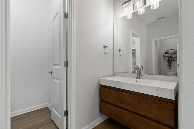 2105 Peoria Dr, Leander, TX 78641 - bathroom featuring vanity and wood finished floors