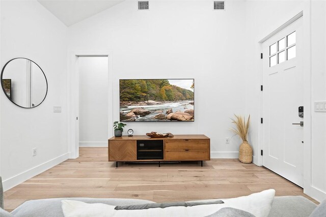2216 Lindell Ave Unit 2, Austin, TX 78704 - entryway with wood finished floors and high vaulted ceiling