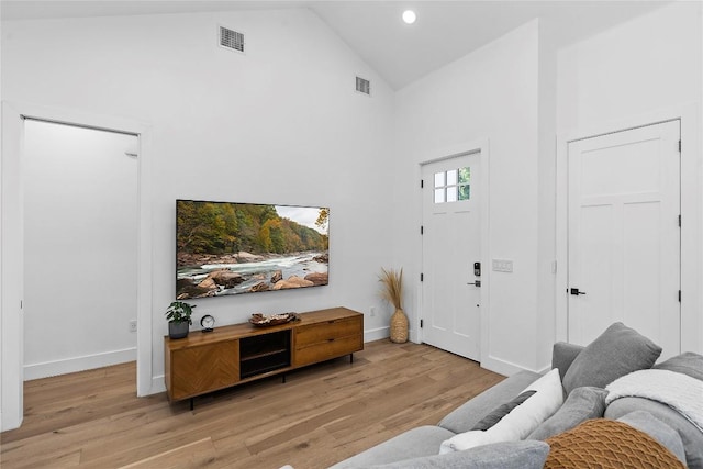 2216 Lindell Ave Unit 2, Austin, TX 78704 - living room with high vaulted ceiling, light wood-type flooring, and recessed lighting