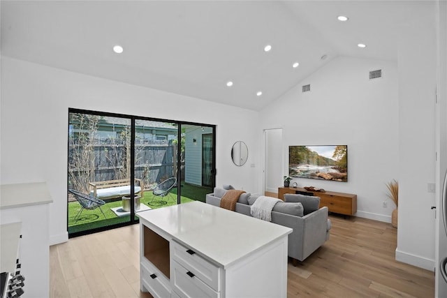 2216 Lindell Ave Unit 2, Austin, TX 78704 - living area featuring light wood-style floors, recessed lighting, and high vaulted ceiling