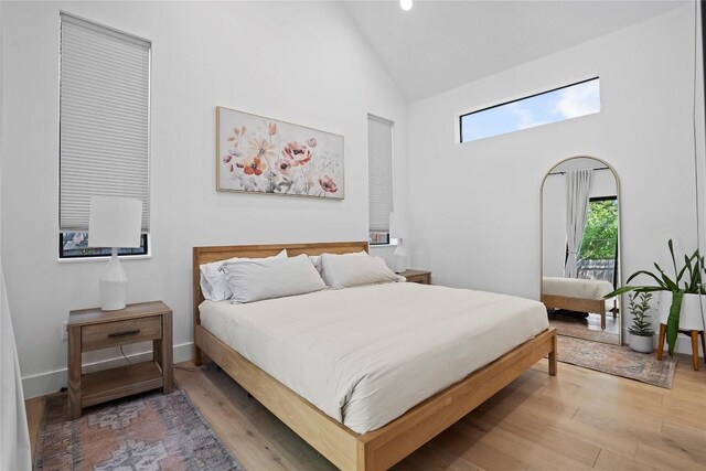 2216 Lindell Ave Unit 2, Austin, TX 78704 - bedroom with wood finished floors, high vaulted ceiling, and recessed lighting
