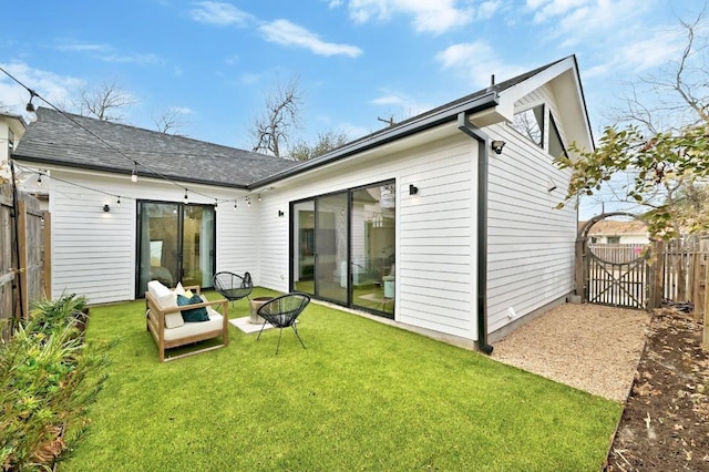 2216 Lindell Ave Unit 2, Austin, TX 78704 - back of house featuring roof with shingles and an outdoor living space with a fire pit